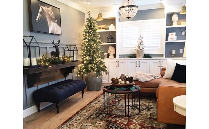 Living room with horse painting and plantation shutters.